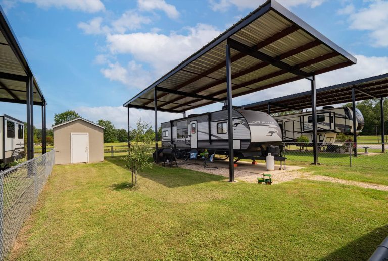 Big rig under a custom 14-foot-high covered RV site at Antique Capital RV Park, Gladewater TX.