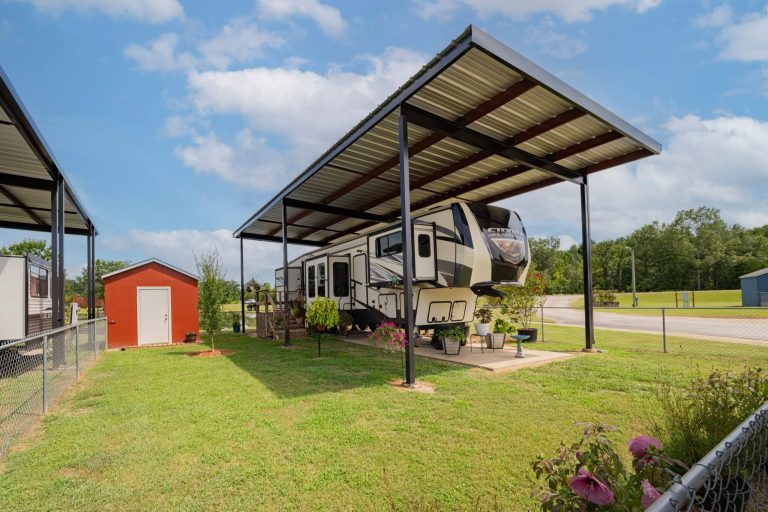Covered RV site with a level concrete pad and full hookups at Antique Capital RV Park in East Texas.