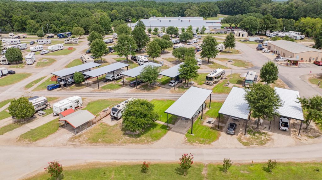 RV parked end to end under a 50 to 60 foot long custom RV cover in Gladewater, East Texas.