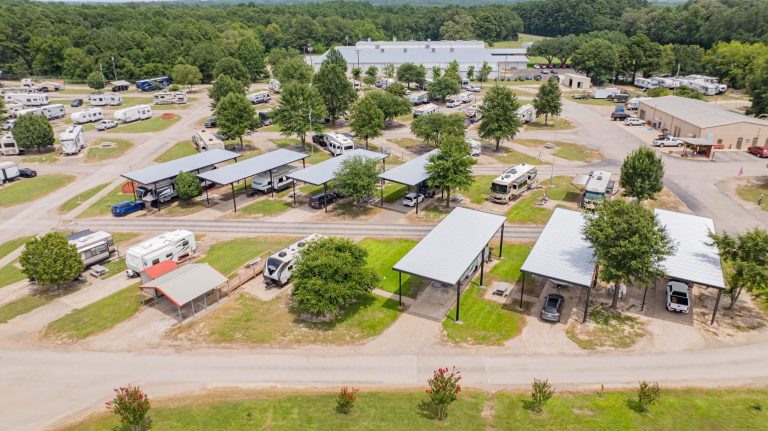 RV parked end to end under a 50 to 60 foot long custom RV cover in Gladewater, East Texas.